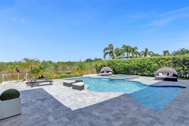 view of swimming pool featuring a patio area, a fenced backyard, and a pool with connected hot tub