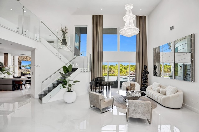 living room with marble finish floor, visible vents, a high ceiling, and stairway