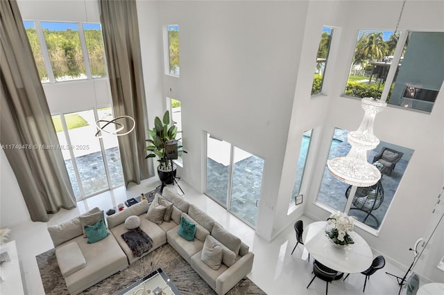 sunken living room with a towering ceiling