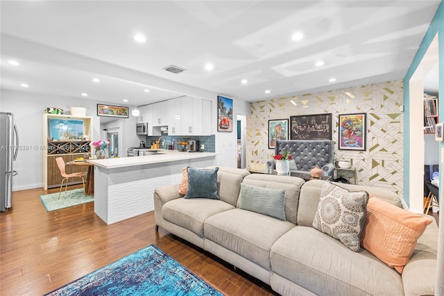 431 NE 110th Ter, Miami, FL 33161 - living area featuring recessed lighting, wood finished floors, and an accent wall