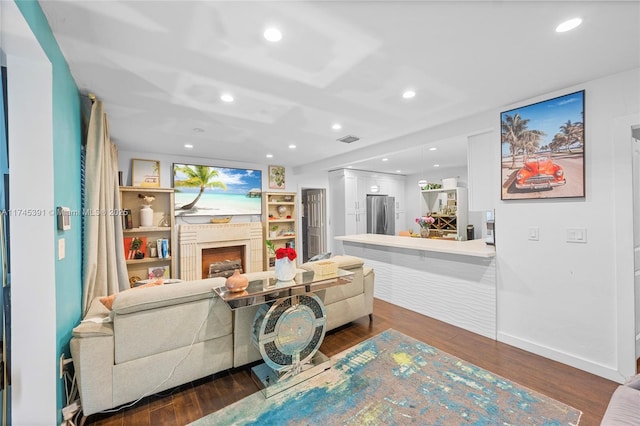 431 NE 110th Ter, Miami, FL 33161 - living room with a fireplace, dark wood-style flooring, and recessed lighting