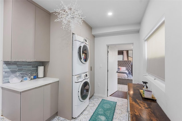 431 NE 110th Ter, Miami, FL 33161 - laundry room featuring stacked washer / drying machine and baseboards