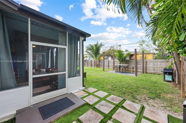 431 NE 110th Ter, Miami, FL 33161 - fenced backyard featuring a sunroom and a patio area