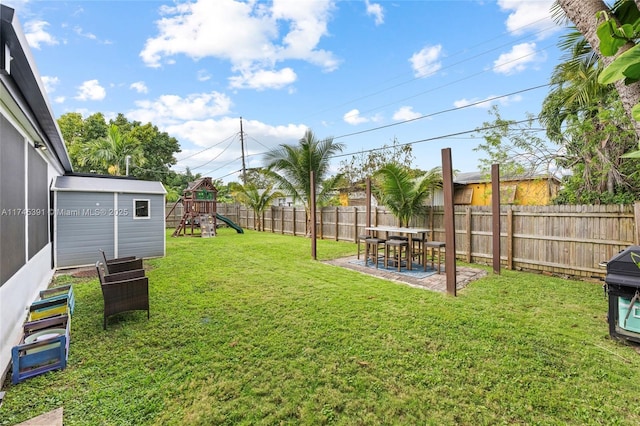 431 NE 110th Ter, Miami, FL 33161 - fenced backyard featuring a playground and a patio area