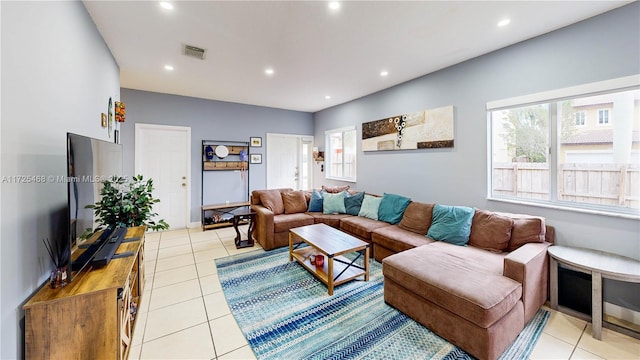 living area featuring recessed lighting, visible vents, and light tile patterned flooring