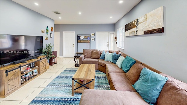 living area with light tile patterned floors, visible vents, and recessed lighting