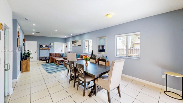 dining area featuring recessed lighting, baseboards, and light tile patterned floors