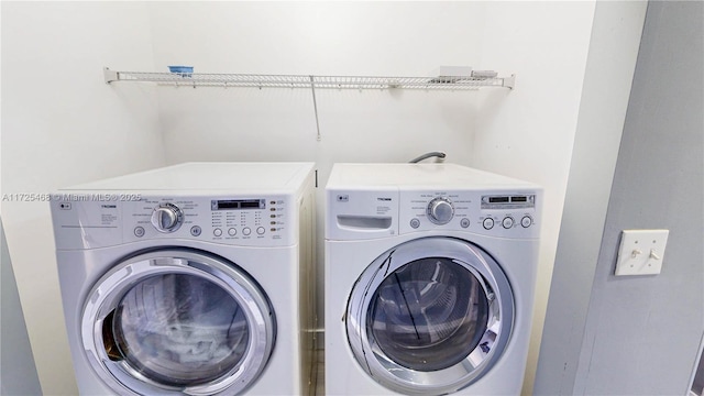 laundry area with washing machine and dryer and laundry area