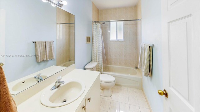 bathroom featuring shower / tub combo, visible vents, toilet, tile patterned flooring, and vanity