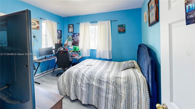 bedroom with wood finished floors