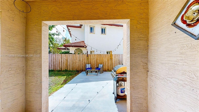 view of patio / terrace with fence
