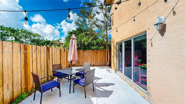 view of patio / terrace featuring a fenced backyard and outdoor dining space