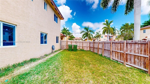 view of yard with a fenced backyard