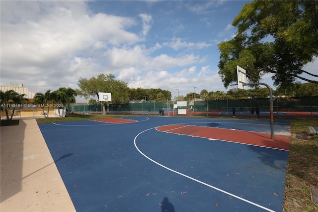 view of basketball court featuring community basketball court and fence