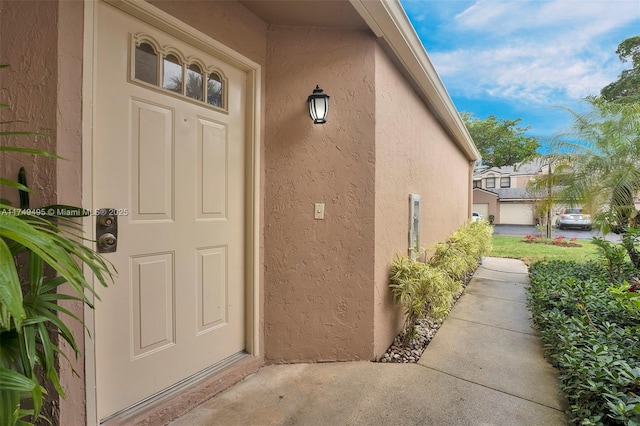 123 NW 98th Ter, Plantation, FL 33324 - doorway to property featuring stucco siding
