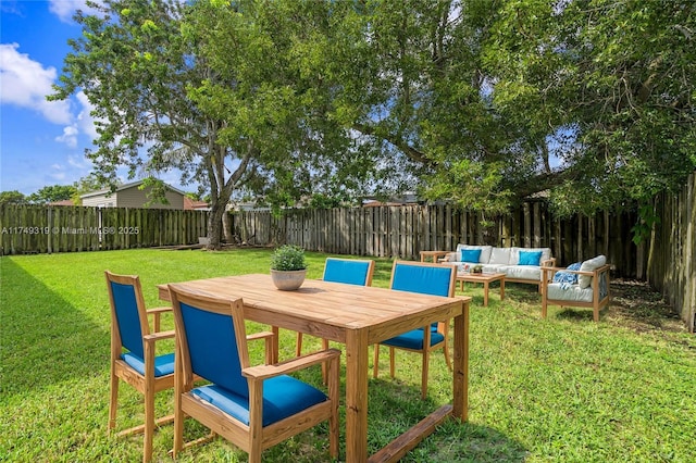 view of yard featuring outdoor lounge area and a fenced backyard