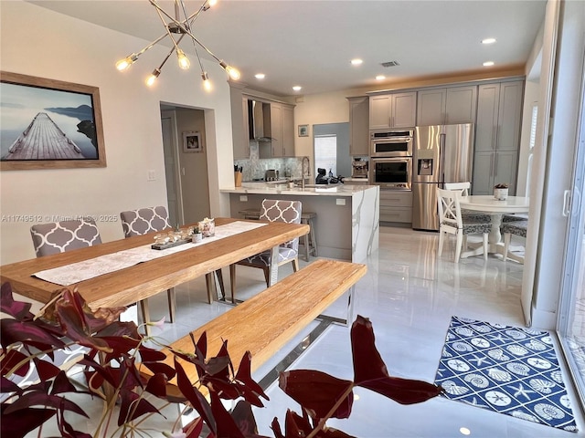 dining room featuring visible vents and recessed lighting