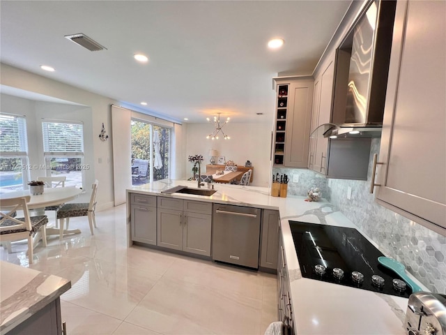 kitchen with a sink, visible vents, gray cabinets, dishwasher, and decorative light fixtures