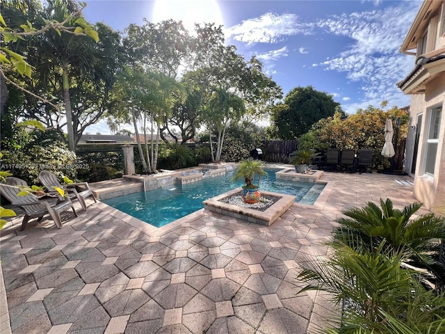 view of swimming pool featuring a patio area, a fenced backyard, and a fenced in pool