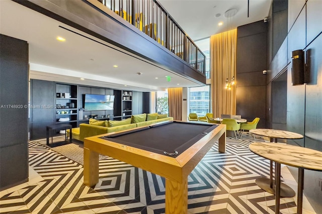 rec room with a towering ceiling, billiards, and recessed lighting