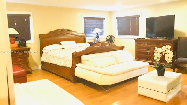 bedroom with wood finished floors