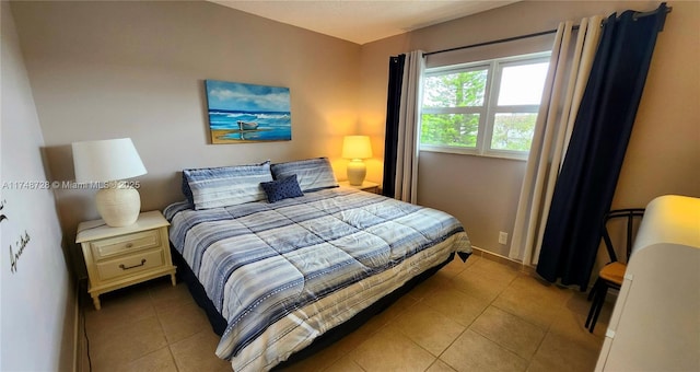 bedroom with light tile patterned flooring