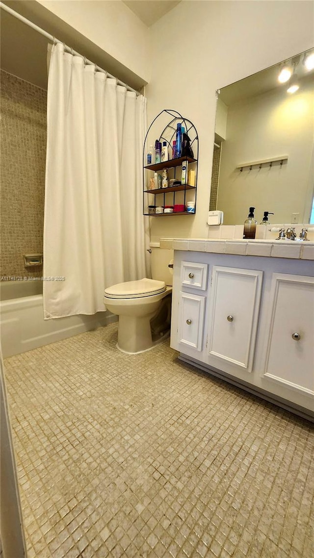 full bathroom featuring toilet, shower / bathtub combination with curtain, tile patterned flooring, and vanity