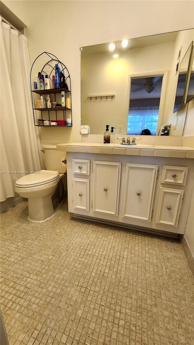 full bath with toilet and vanity