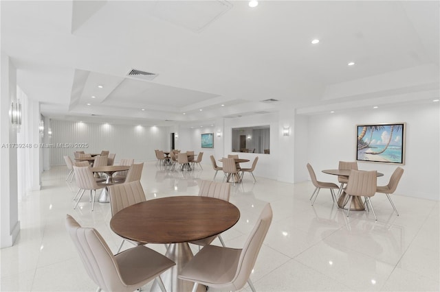 dining room with recessed lighting, a tray ceiling, visible vents, and light tile patterned floors