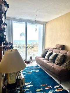 living area featuring floor to ceiling windows