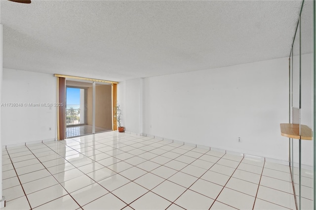 spare room with a textured ceiling
