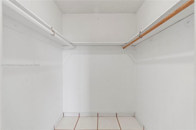spacious closet with tile patterned flooring