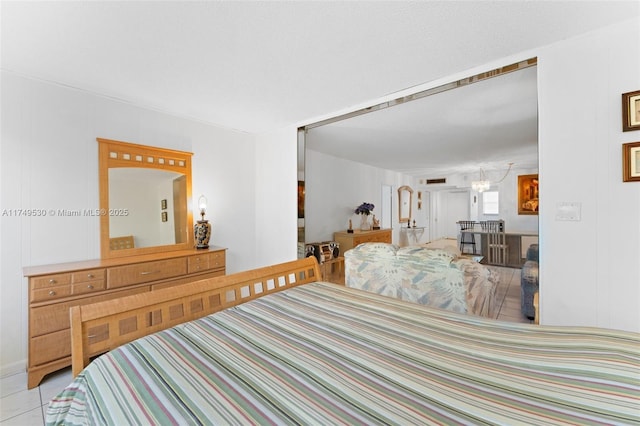 445 NE 195th St Unit 324, Miami, FL 33179 - bedroom featuring a chandelier