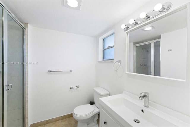 445 NE 195th St Unit 324, Miami, FL 33179 - bathroom featuring toilet, vanity, baseboards, tile patterned floors, and a stall shower