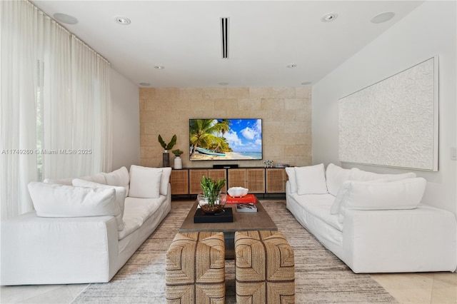 living area featuring recessed lighting and light tile patterned flooring