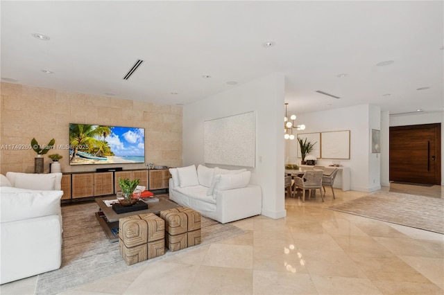 living room featuring a chandelier, recessed lighting, visible vents, and tile walls