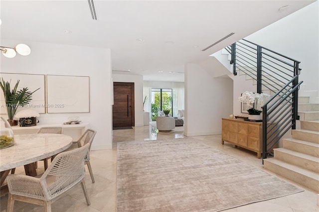 foyer featuring stairs, marble finish floor, recessed lighting, and baseboards