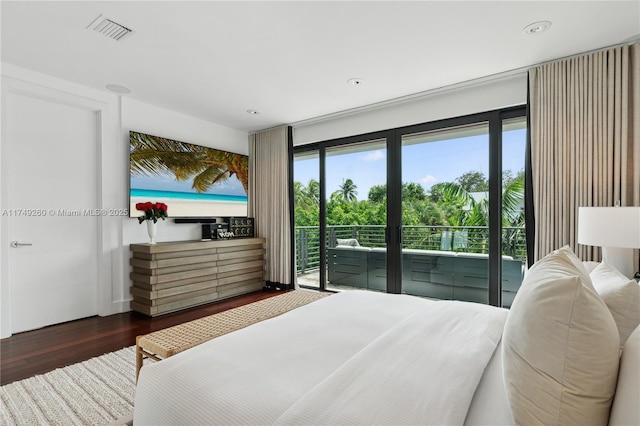 bedroom featuring access to outside, dark wood-style flooring, and visible vents