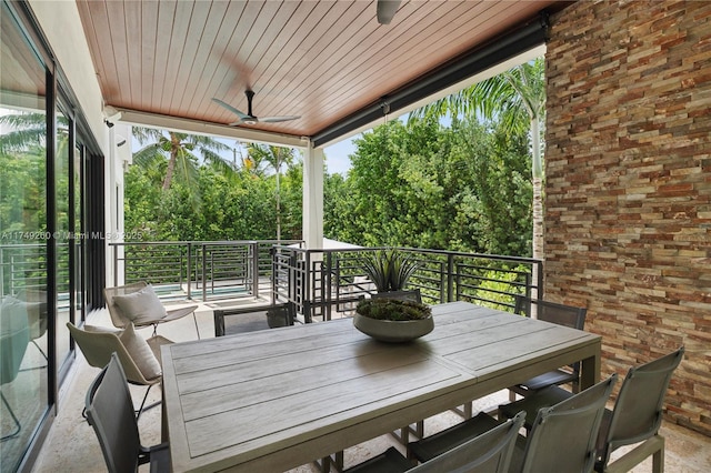 deck featuring ceiling fan and outdoor dining space