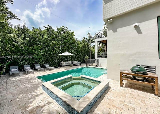 view of pool featuring an outdoor hangout area, a patio area, and a pool with connected hot tub