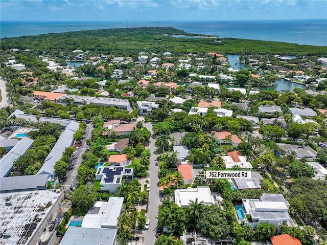 birds eye view of property featuring a water view and a residential view