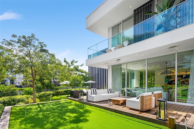 exterior space featuring a deck, an outdoor living space, and a balcony