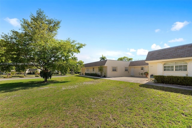 17084 SW 112th Ct Unit V3142, Miami, FL 33157 - view of grassy yard featuring a patio area