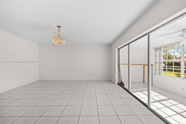17084 SW 112th Ct Unit V3142, Miami, FL 33157 - unfurnished room with a ceiling fan, a chandelier, and light tile patterned flooring