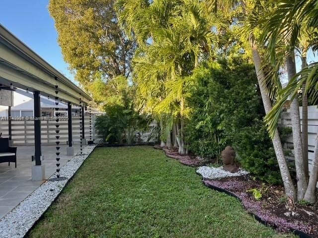 view of yard featuring a fenced backyard and a patio