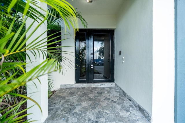 28451 SW 164th Ave, Homestead, FL 33033 - view of exterior entry featuring french doors and stucco siding
