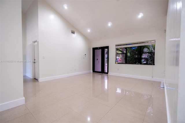 28451 SW 164th Ave, Homestead, FL 33033 - unfurnished room with high vaulted ceiling, recessed lighting, baseboards, and light tile patterned floors