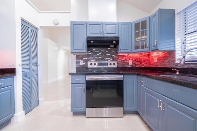 28451 SW 164th Ave, Homestead, FL 33033 - kitchen with stainless steel electric stove, under cabinet range hood, backsplash, a sink, and glass insert cabinets