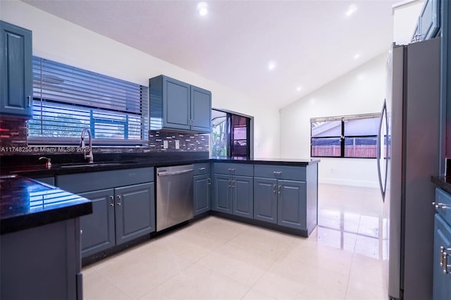28451 SW 164th Ave, Homestead, FL 33033 - kitchen with appliances with stainless steel finishes, tasteful backsplash, dark countertops, a peninsula, and a sink