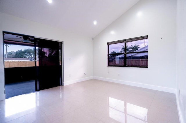 28451 SW 164th Ave, Homestead, FL 33033 - tiled spare room with baseboards, high vaulted ceiling, and recessed lighting